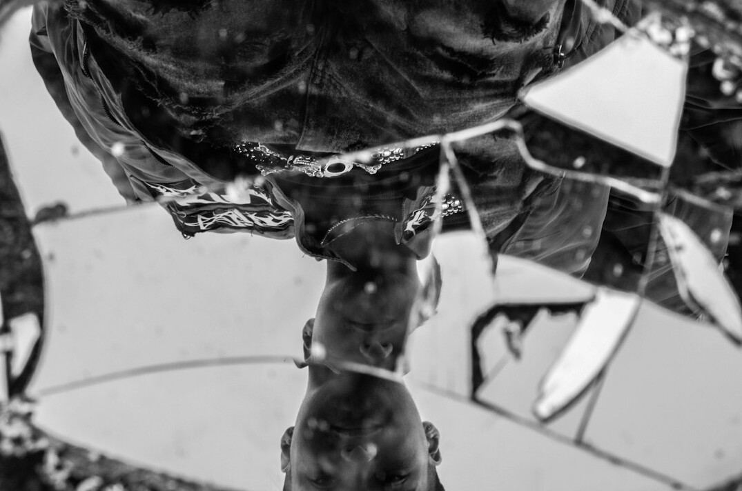 Abstract fragmented reflection in a broken mirror